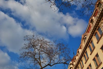 Low angle view of building against cloudy sky