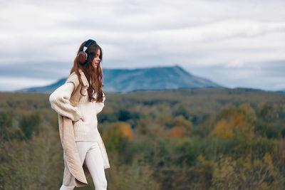 Young woman standing on mountain
