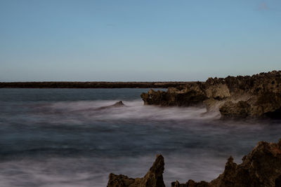 Scenic view of sea against clear sky