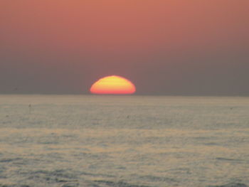 Scenic view of sunset over sea