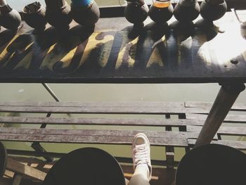 Low section of woman standing on tiled floor