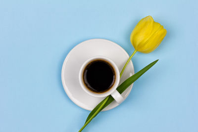 Directly above shot of coffee on table against white background