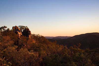 Scenic view of mountains against clear sky during sunset