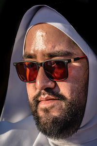 Close-up portrait of a man wearing sunglasses