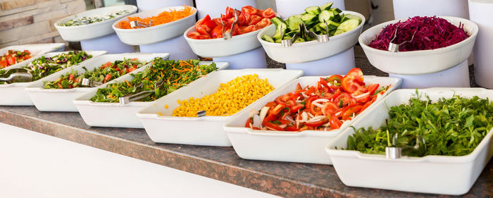 Various fruits in bowl on table