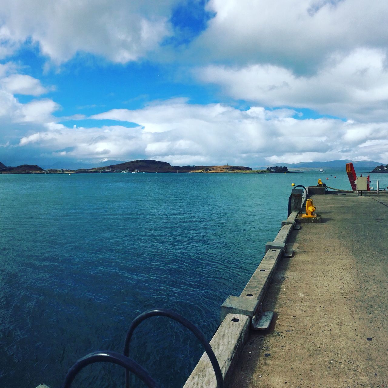 water, sky, cloud - sky, sea, nautical vessel, cloudy, transportation, tranquility, scenics, cloud, tranquil scene, nature, beauty in nature, mode of transport, boat, day, pier, incidental people, blue, outdoors