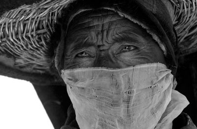 Close-up portrait of man covering face
