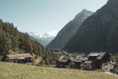 Rural scene in the swiss mountains with wooden chalets