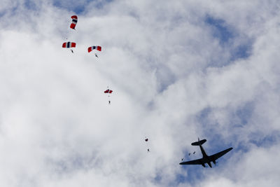 Low angle view of helicopter flying in sky