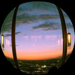 Scenic view of sky seen through glass window during sunset