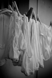 Close-up of clothes drying against white background