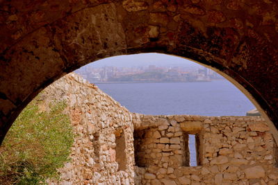 View of old building through arch window