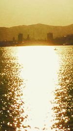 Close-up of yellow sea against sky during sunset