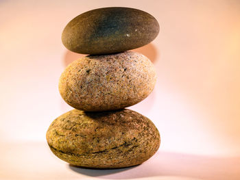 Close-up of stacked pebbles on table