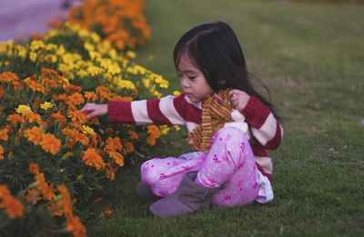 Close-up of woman holding flowers