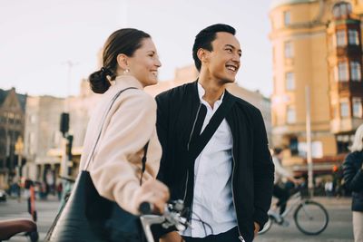 Side view of a smiling young couple