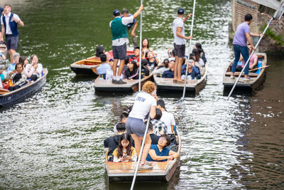 People sitting on boat in river