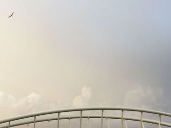 Low angle view of railing against sky