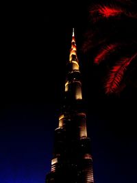 Low angle view of illuminated building at night