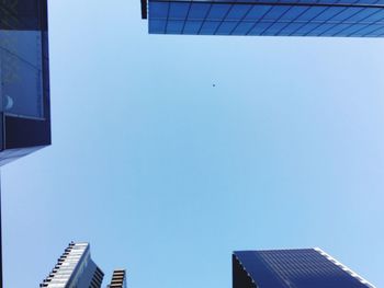 Exterior of modern buildings against clear blue sky