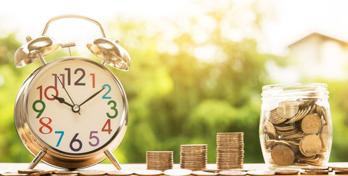 Close-up of coins on table against blurred background