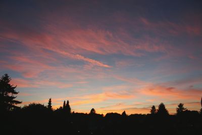 Silhouette of trees against sky at sunset