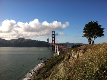 View of suspension bridge over sea