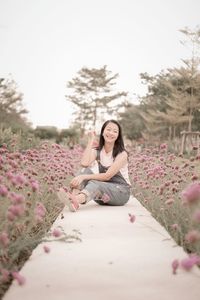 Young woman sitting on field