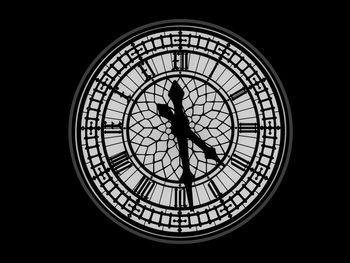 Low angle view of silhouette people on glass window