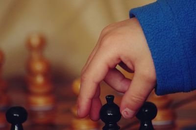 Close-up of hand holding bottle