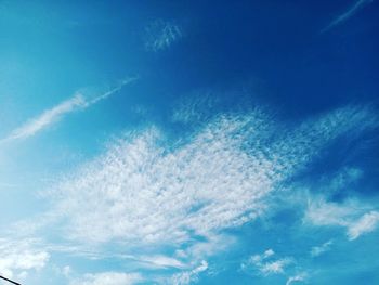 Low angle view of vapor trail in blue sky