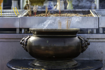 Close-up of tea cup in temple