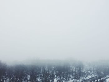 Scenic view of landscape against sky during winter