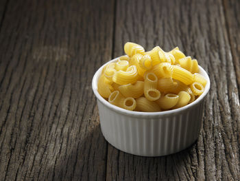 Close-up of macaroni pasta on table