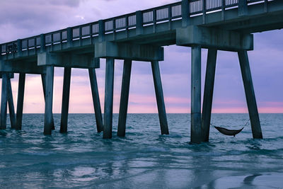 Pier on sea against sky