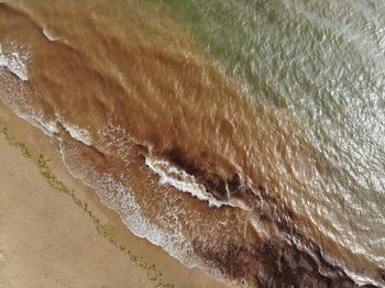 High angle view of surf on beach