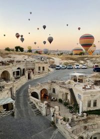 View of hot air balloon flying over city