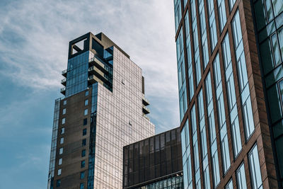 Low angle view of modern buildings against sky