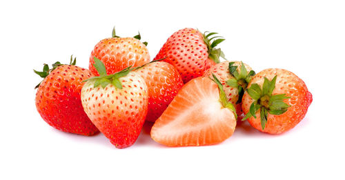 Close-up of fruits against white background