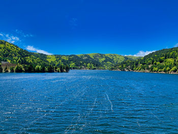 Scenic view of sea against blue sky