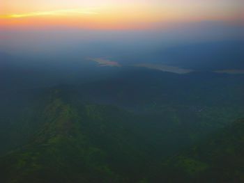 Aerial view of landscape against sky during sunset