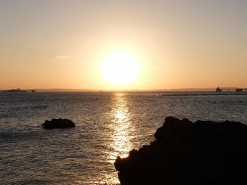 Scenic view of sea at sunset