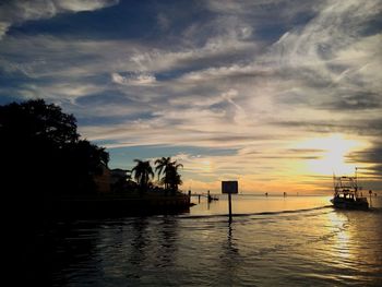 Scenic view of river against sky during sunset