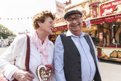 Senior couple having fun on fair