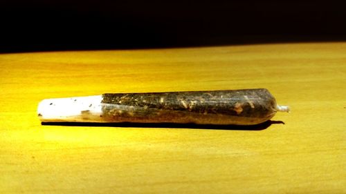 Close-up of cigarette on table