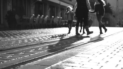 People walking at railroad station