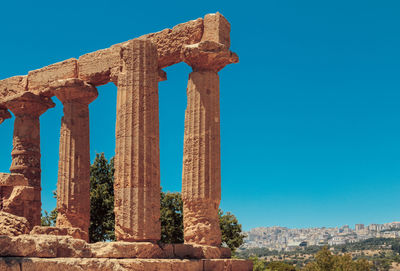 Low angle view of old ruin against blue sky