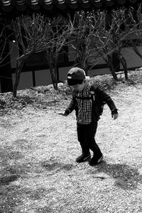 Full length of girl standing on railing