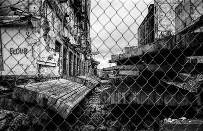 Close-up of chainlink fence against sky
