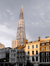 Low angle view of buildings in city against sky